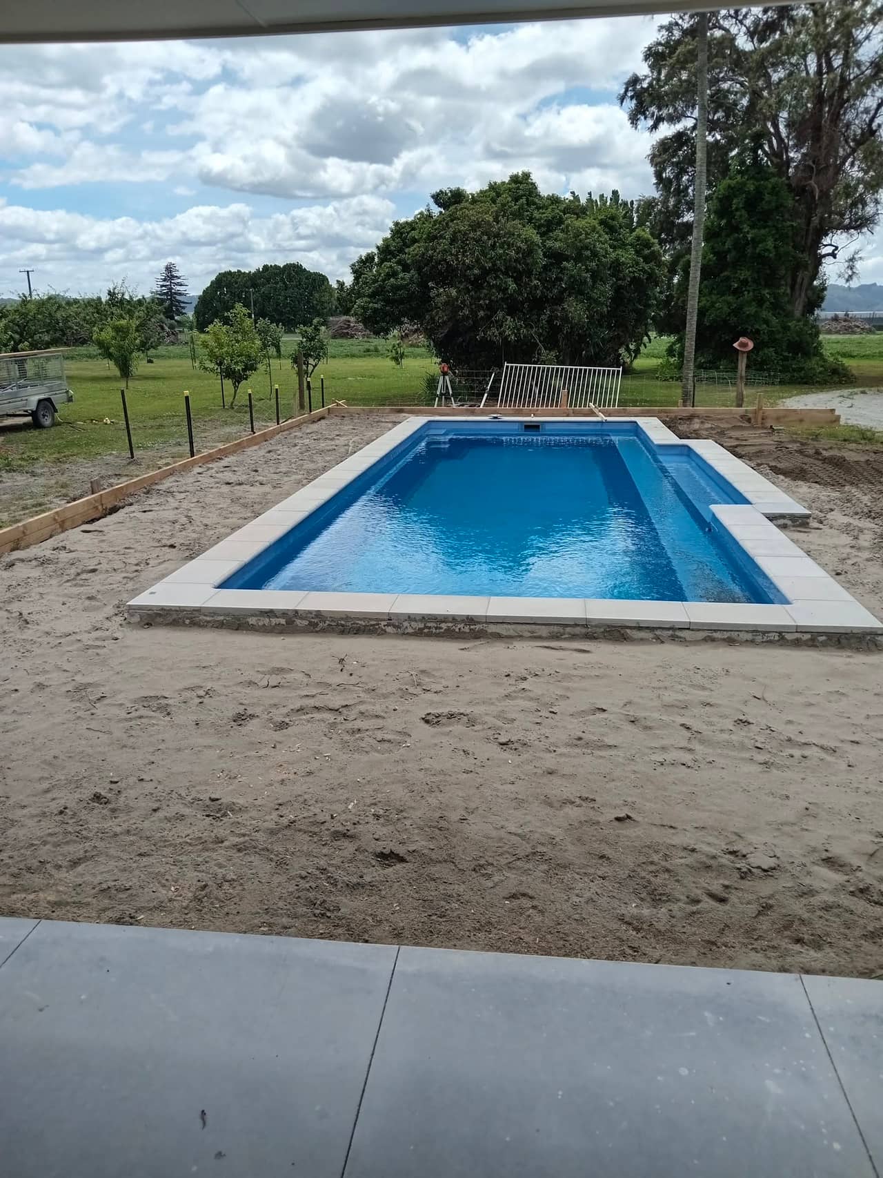 Site measured and prepared with a sand base for a pool surround