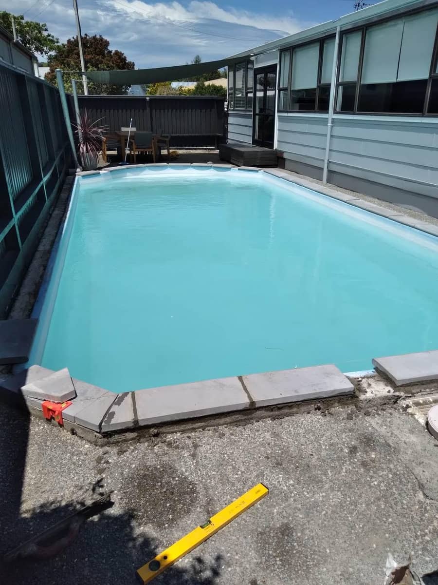 Pool renovation in progress with coping being installed, Gisborne